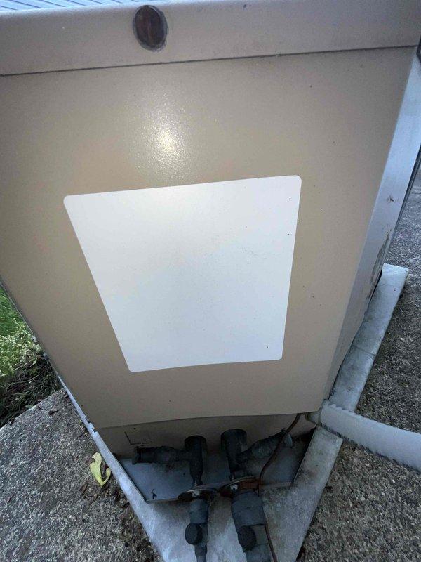 Provided comprehensive estimate for complete HVAC system replacement for small to mid-sized residential property (0-1200 sq ft) requiring heating and cooling capabilities with natural gas or propane energy source. Assessed existing outdoor condensing unit positioned on concrete pad in side-yard location between structures, evaluating current installation including refrigerant lines, electrical conduit, and drainage connections. Documented equipment configuration and site conditions to develop accurate proposal for new system installation.