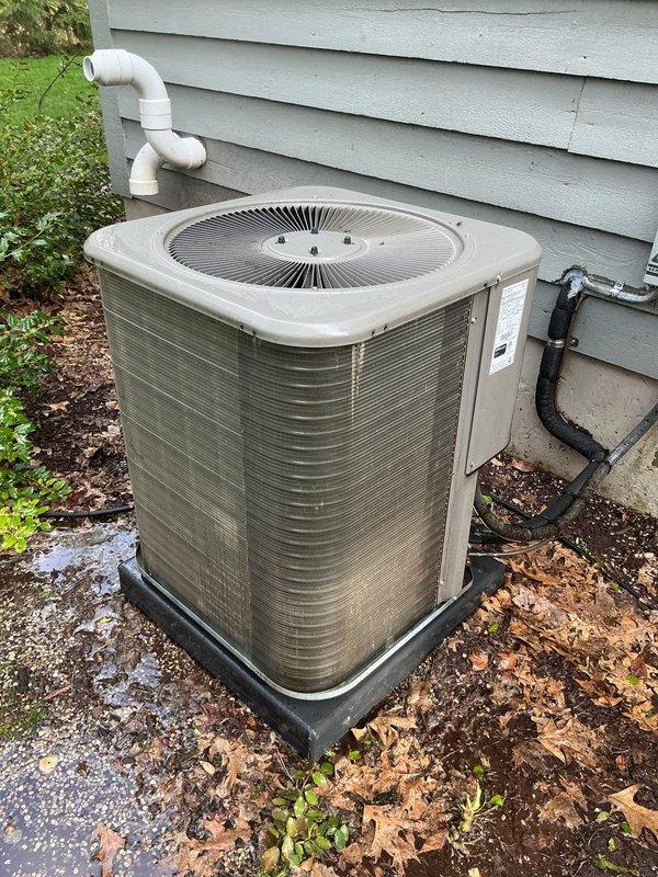 Completed annual preventive maintenance on residential split system air conditioning unit. Performed comprehensive inspection of outdoor condenser unit, verified proper operation of condenser fan motor and compressor, checked refrigerant line insulation integrity, and confirmed electrical connections were secure. Cleaned condenser coils, inspected unit mounting and pad condition, and documented system condition with photographs. Unit operating within normal parameters at time of service completion.