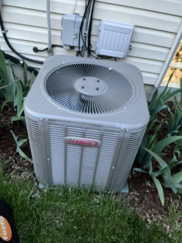 Completed annual comprehensive maintenance on a 5-ton Lennox split system. Inspected indoor evaporator coil assembly with aluminum fin construction, verified condensate drain line operation, and confirmed proper refrigerant line connections. Exterior condenser unit inspection revealed clean coil surfaces, operational fan assembly, and secure electrical connections at disconnect box. All system components operating within normal parameters with no deficiencies noted.