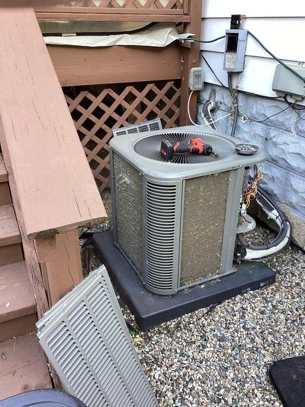 Performed routine preventative maintenance on residential split system air conditioning unit. Conducted comprehensive inspection including refrigerant pressure readings using manifold gauge set, verified electrical connections at disconnect box, inspected condenser coil condition, and confirmed proper fan operation. System operating within normal parameters with no deficiencies noted.
