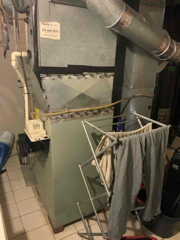 Conducted on-site assessment for air conditioner replacement in residential basement utility area. Evaluated existing HVAC system including furnace, air handler, and ductwork configuration. Documented current equipment condition, measured ductwork dimensions, and photographed system components to prepare comprehensive replacement estimate for new AC installation with expedited timeline per customer request.