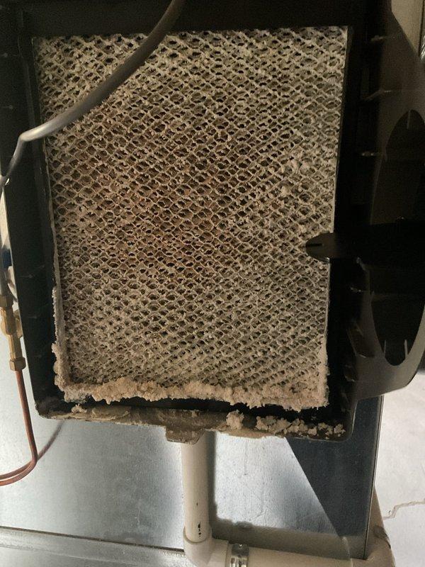 Completed annual cooling maintenance on HVAC system. Inspected heavily soiled air filter showing significant accumulation of dust and debris, restricting airflow through the unit. Performed electrical diagnostics using clamp meter to verify proper amperage draw on blower motor and system components. Replaced dirty air filter and completed standard preventive maintenance checklist to ensure optimal system performance for the cooling season.