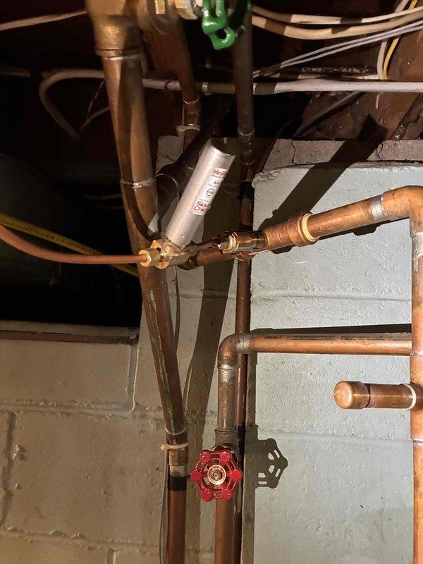 Responded to water leak originating from exterior hose bibb. Inspected copper plumbing system and identified source of leak at hose bibb connection. Additionally, connected whole-home humidifier to plumbing system that had been left unhooked following previous water heater replacement. Verified proper operation of humidifier connection and ensured all plumbing connections were secure with no active leaks upon completion.