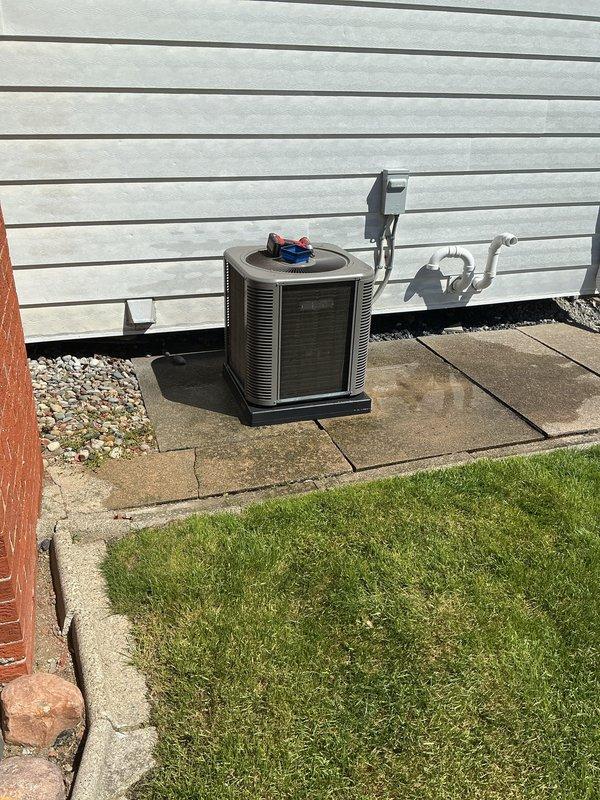 Performed comprehensive air conditioning tune-up on residential outdoor condenser unit. Completed full system inspection including refrigerant line examination, electrical connections verification, and condenser coil assessment. Replaced air filter and ensured proper airflow throughout system. Unit was uncovered and prepared for cooling season operation. All components tested and operating within normal parameters upon completion.
