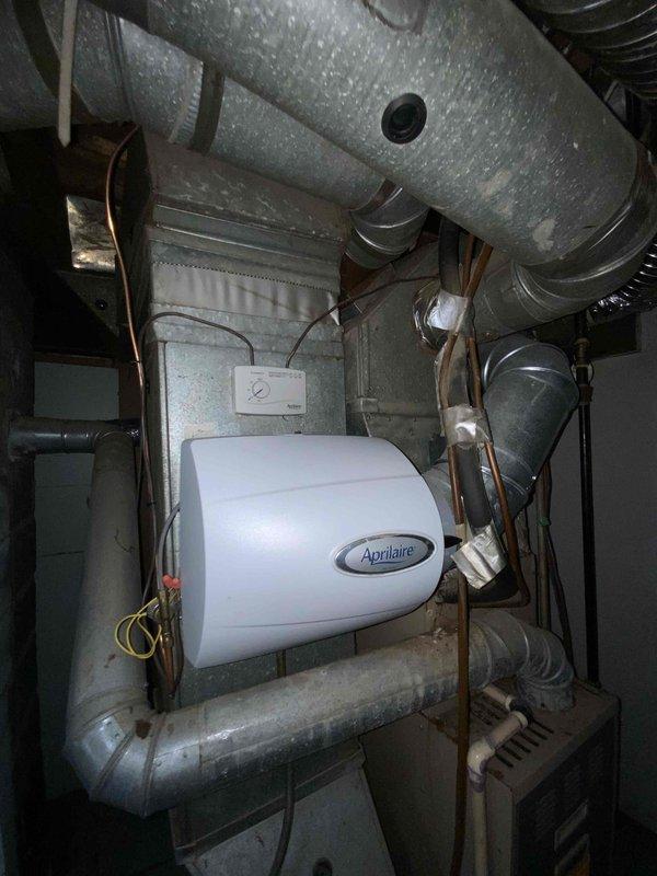 Provided comprehensive estimate for complete HVAC system replacement in basement location, including new furnace and air conditioning unit under BOGO promotion, as existing 10+ year old furnace was non-operational. Assessment included evaluation of current equipment setup featuring Aprilaire humidifier, existing ductwork configuration, and cramped mechanical room layout with concrete block walls. Additional estimate provided for electrical panel upgrade and installation of 220V outlets for dryer and stove applications to meet homeowner's requirements.