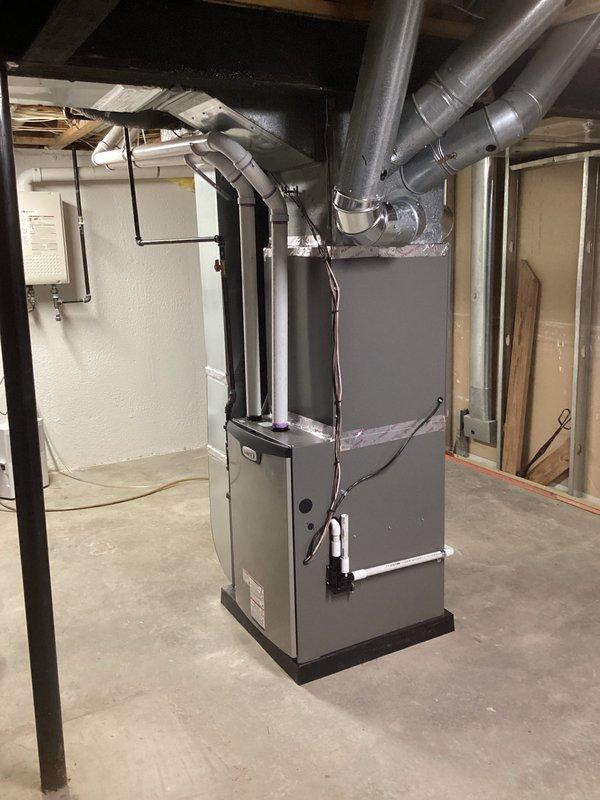 Completed full HVAC system installation including a 90,000 BTU furnace and 3-ton air conditioning unit with left-side configuration. Installed new ductwork connections from furnace to overhead distribution system, established proper refrigerant lines, and completed all electrical reconnections. All required mechanical, refrigeration, and electrical permits were obtained prior to installation, and system was tested for proper operation upon completion.