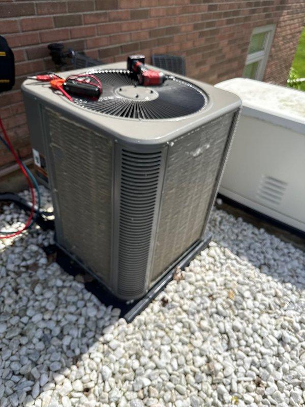 Performed annual maintenance on outdoor condensing unit. Conducted electrical diagnostics using multimeter to verify proper voltage and amperage readings across system components. Inspected condenser coil and found 2-5 spots requiring filter cleaning attention. Tested system operation and confirmed unit running within manufacturer specifications. All electrical connections secure and operational parameters normal.