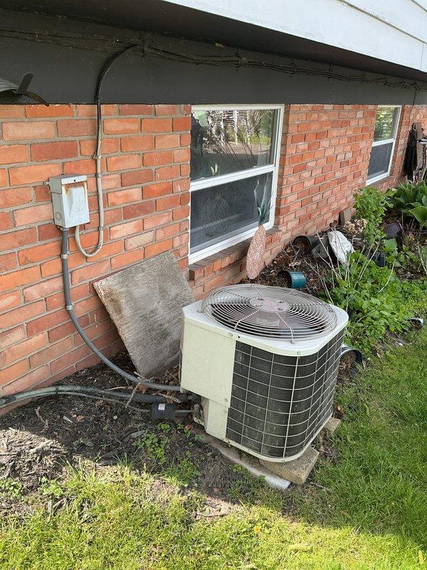 Responded to no cooling call on residential air conditioning system. Upon arrival, performed complete system diagnostic including inspection of outdoor condenser unit and attic-mounted air handler. Evaluated refrigerant levels, electrical connections, and overall system operation. Documented equipment condition through photographs showing outdoor unit placement on concrete pad with visible weathering and dirt accumulation, along with attic air handler installation. Provided customer with diagnostic findings and discussed repair options versus replacement considerations based on system assessment.