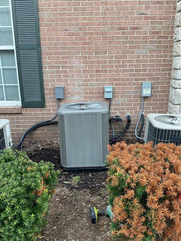 Completed full HVAC system installation including a 70,000 BTU gas furnace, 2-ton air conditioning unit with front-discharge configuration, humidifier, and Bradford White water heater. Installed all necessary ductwork, refrigerant lines, electrical disconnects, and plumbing connections with copper piping and shut-off valves. All mechanical, plumbing, and electrical work completed per permit requirements, with equipment positioned exterior condenser on ground-level pad and interior components in utility closet.