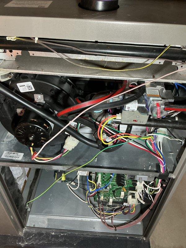 Completed annual HVAC maintenance inspection on air handler unit, performing comprehensive heating and cooling system evaluation. Accessed internal components, inspected control board, electrical connections, blower motor assembly, and all wiring harnesses for proper operation and signs of wear. All components found in satisfactory working condition with system operating within normal parameters.