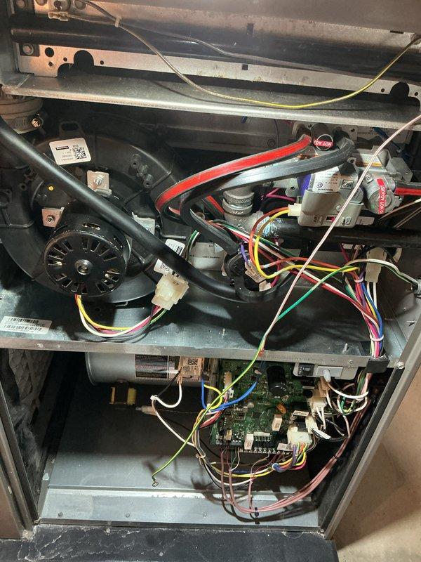 Completed annual HVAC maintenance inspection on air handler unit, performing comprehensive heating and cooling system evaluation. Accessed internal components, inspected control board, electrical connections, blower motor assembly, and all wiring harnesses for proper operation and signs of wear. All components found in satisfactory working condition with system operating within normal parameters.