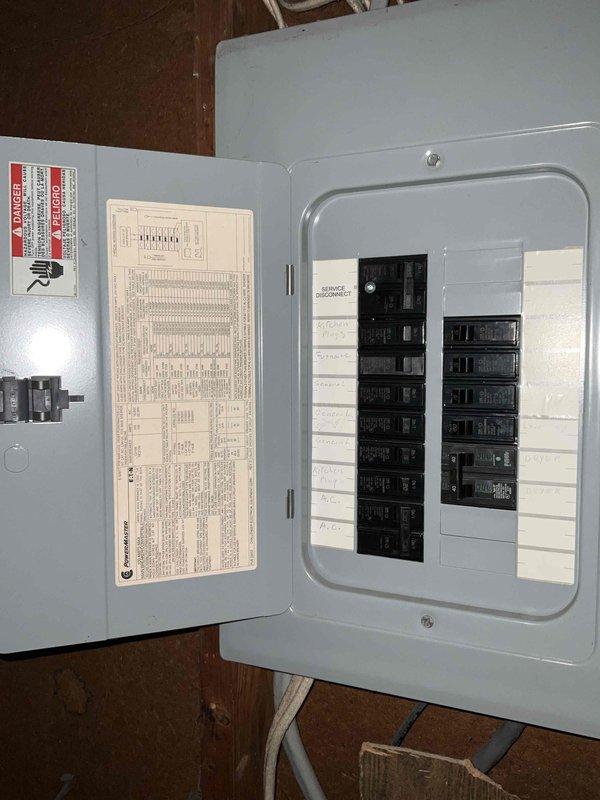 Performed comprehensive assessment of non-functional 12-year-old air conditioning system requiring full replacement. Documented existing equipment specifications including refrigerant evaporator coil and heat pump components, photographed manufacturer labels with technical ratings and serial numbers, and inspected electrical panel configuration to determine replacement requirements and ensure proper system compatibility for quote preparation.