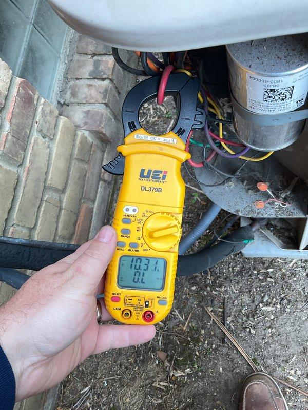Performed annual cooling maintenance on HVAC system. Measured electrical amperage draw on compressor unit using clamp meter, recording 103.1 amps at outdoor condenser and 58.3 amps at indoor air handler to verify proper system operation. Inspected refrigerant lines, copper piping, and electrical connections at both indoor and outdoor units. All components operating within normal parameters at time of inspection.