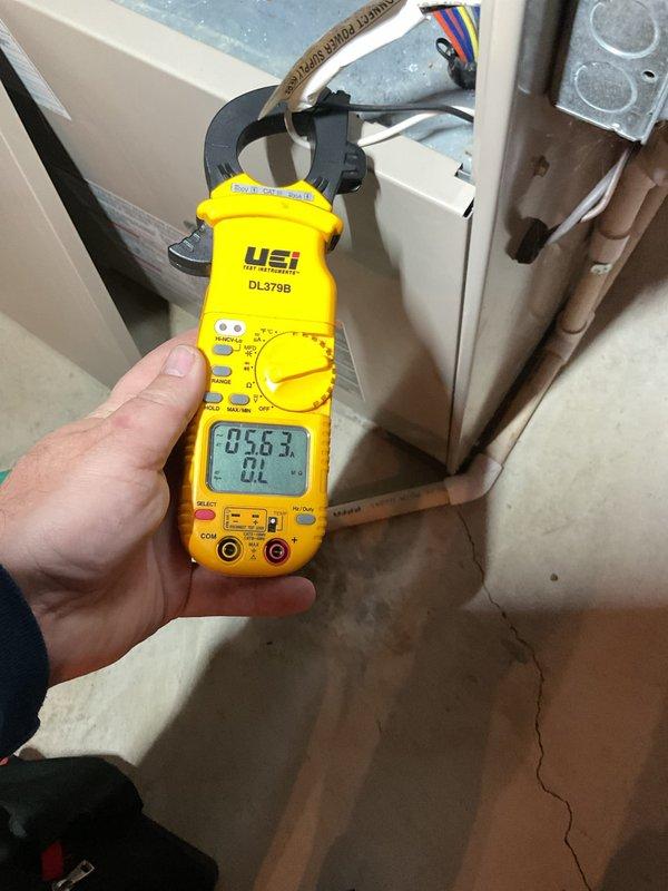 Performed annual cooling maintenance on HVAC system. Measured electrical amperage draw on compressor unit using clamp meter, recording 103.1 amps at outdoor condenser and 58.3 amps at indoor air handler to verify proper system operation. Inspected refrigerant lines, copper piping, and electrical connections at both indoor and outdoor units. All components operating within normal parameters at time of inspection.