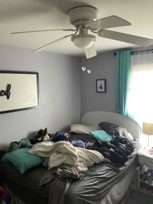 Conducted on-site evaluation for mini split installation in upstairs bedrooms as alternative to existing 16-year-old Arzel zone system. Assessed multiple rooms for ductless mini split head unit placement, documented ceiling fan clearances and wall configurations to determine optimal mounting locations. Provided estimate options for complete zone system removal and replacement with ductless mini split heat pump system for improved comfort control and energy efficiency in upper level living spaces.