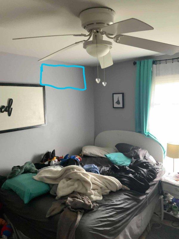 Conducted on-site evaluation for mini split installation in upstairs bedrooms as alternative to existing 16-year-old Arzel zone system. Assessed multiple rooms for ductless mini split head unit placement, documented ceiling fan clearances and wall configurations to determine optimal mounting locations. Provided estimate options for complete zone system removal and replacement with ductless mini split heat pump system for improved comfort control and energy efficiency in upper level living spaces.