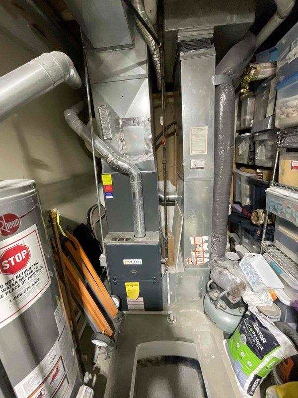 Provided comprehensive estimate for complete HVAC system replacement to address 20-year-old equipment operating at diminished capacity. Assessed existing natural gas furnace and air conditioning unit located in backyard and interior mechanical space, documenting current system configuration including ductwork, venting, and electrical connections. Presented options for new high-efficiency equipment installation to improve cooling performance and system reliability.