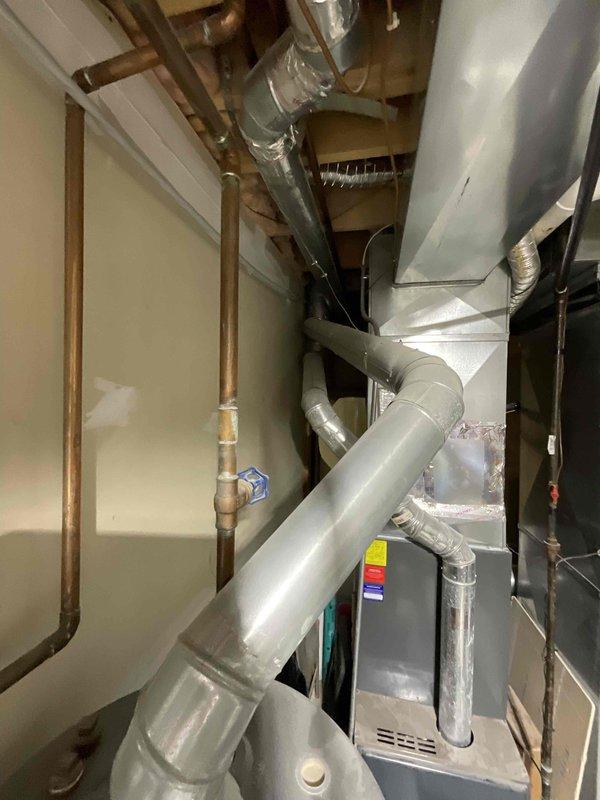 Provided comprehensive estimate for complete HVAC system replacement to address 20-year-old equipment operating at diminished capacity. Assessed existing natural gas furnace and air conditioning unit located in backyard and interior mechanical space, documenting current system configuration including ductwork, venting, and electrical connections. Presented options for new high-efficiency equipment installation to improve cooling performance and system reliability.