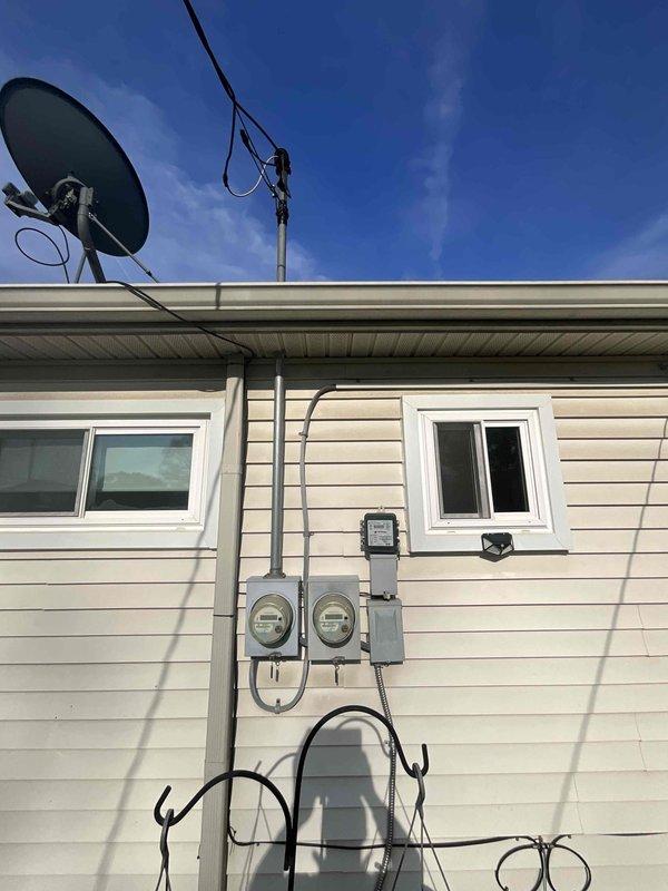 Conducted site evaluation for replacement estimate of 22-year-old residential HVAC system located on north side of property. Assessed existing furnace and non-operational air conditioning unit in mechanical room, documenting equipment configuration including air handler, ductwork layout, and clearance measurements. Evaluated exterior utility connections, electrical service accessibility, and equipment placement requirements to provide comprehensive replacement specifications for both heating and cooling systems.
