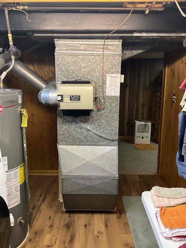 Provided comprehensive estimate for complete HVAC system replacement in basement location, including both furnace and air conditioning equipment. Current 20+ year old system remains operational but has reached end of expected service life. Assessment included evaluation of existing air handler unit, ductwork configuration, electrical panel capacity and circuit availability, and clearance requirements for new equipment installation.