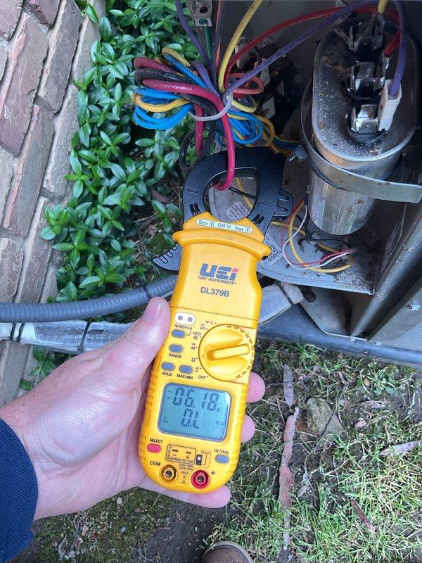 Responded to return service call for air conditioning maintenance. Upon arrival, performed comprehensive electrical diagnostics on outdoor condensing unit using digital multimeter. Measured voltage and amperage readings at compressor and capacitor connections to verify proper system operation. Tested capacitor functionality and confirmed all electrical components within manufacturer specifications. Inspected wire connections and terminals for secure contact. Documented electrical readings for service records. System operating normally with all measurements within acceptable parameters.