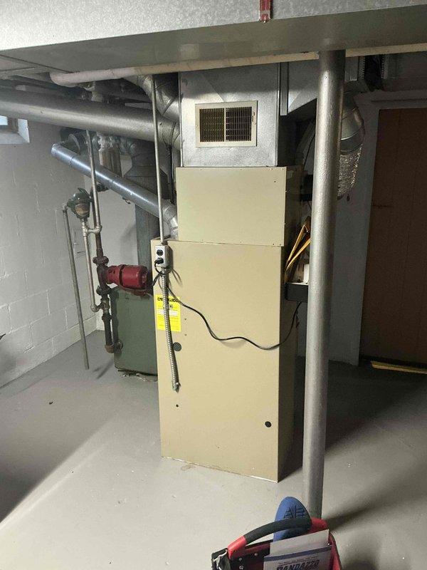 Provided estimate for complete HVAC system replacement in basement installation serving small to mid-sized residential space up to 1200 square feet. Existing 30-year-old heating and cooling equipment assessed, with air conditioning system currently non-operational. Replacement scope includes new natural gas furnace and air conditioning unit with appropriate ductwork modifications and condensate management system for basement location.