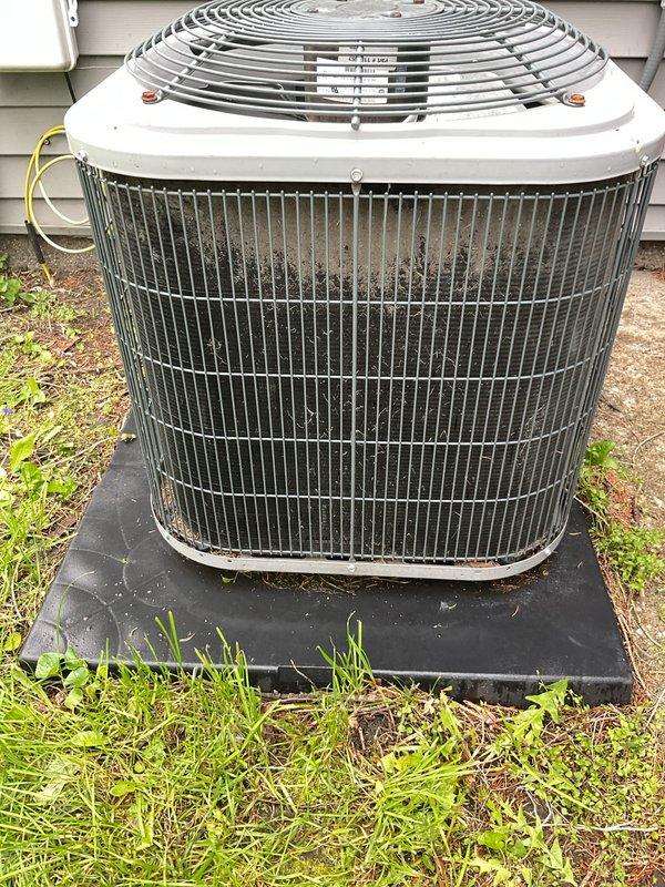 Completed annual cooling maintenance on residential air conditioning system. Performed electrical diagnostics on indoor air handler using digital multimeter to verify proper voltage and amperage readings across control circuits and components. Inspected outdoor condenser unit, noting dirt and debris accumulation on coil fins and wire guard assembly. Unit operational at time of service with all electrical parameters within normal operating range. Documented system condition with photographs for maintenance records.