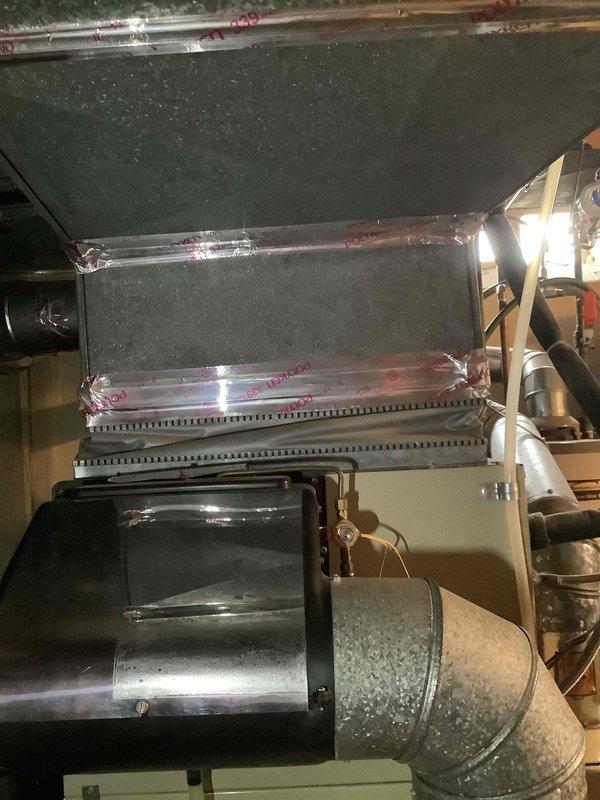Completed comprehensive HVAC estimate for full system replacement in residential property. Evaluated existing air handler unit with evaporator coil assembly, ductwork connections, and blower housing configuration, along with current furnace installation and water heater setup in basement utility area. Documented equipment conditions, system layout, and spatial requirements through detailed photographic assessment to provide accurate replacement specifications and installation planning for new HVAC system.