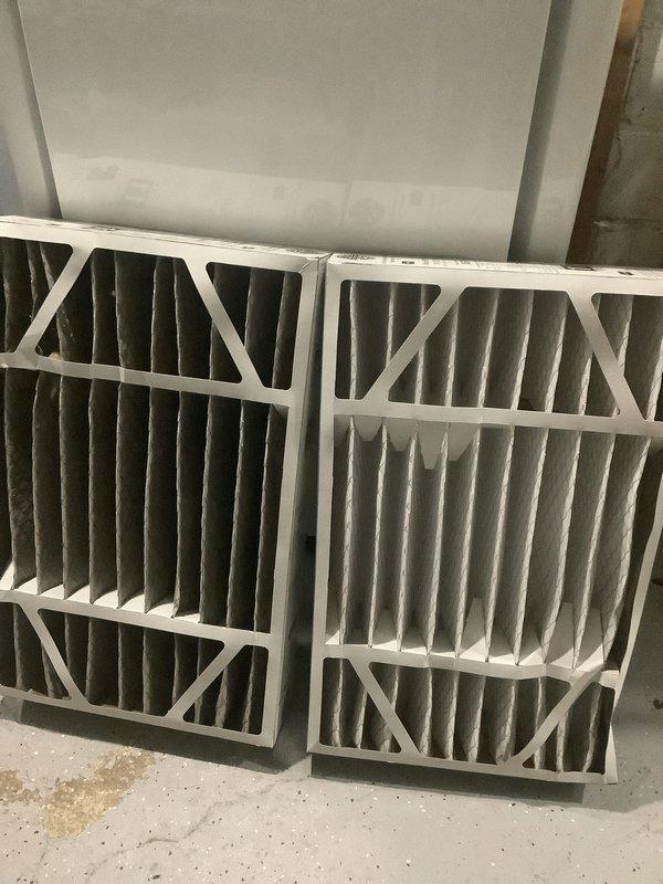 Completed annual cooling maintenance on residential split system. Performed comprehensive inspection of condensing unit and air handler, checked refrigerant levels, verified electrical connections, tested thermostat operation, and confirmed proper system airflow. Documented existing air filters showing normal dust accumulation; filters were photographed for records but replacement was not required at this time per maintenance schedule.