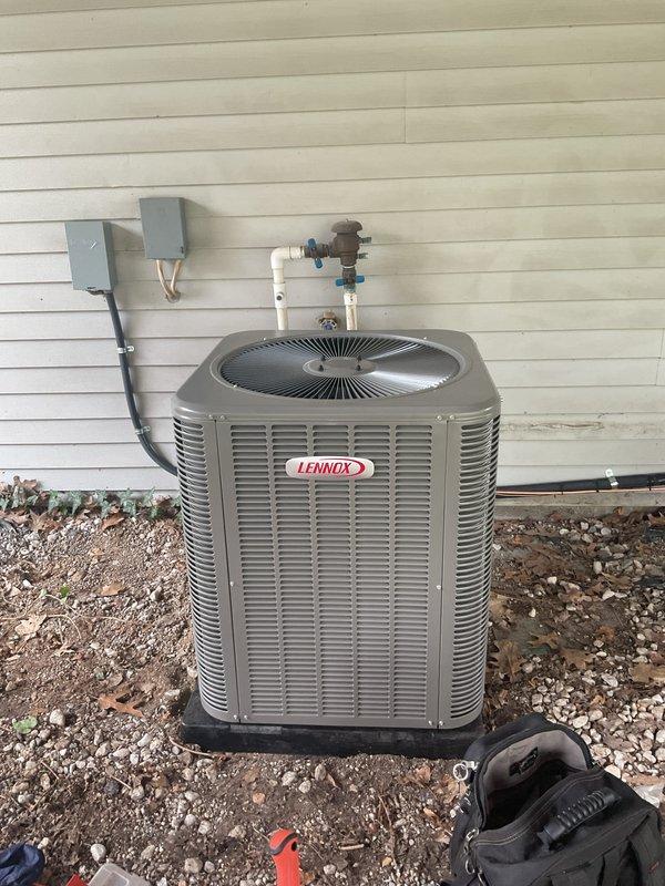 Successfully completed installation of new Lennox outdoor condensing unit and indoor evaporator coil system. Positioned exterior condenser on vibration-dampening pad against building foundation with proper clearances, connected refrigerant lines through wall penetration, and installed electrical disconnect boxes with appropriate conduit. Indoor evaporator coil was integrated with existing Carrier furnace in basement mechanical room, with refrigerant lines properly insulated and routed. Verified all electrical connections, tested refrigerant line integrity, and ensured proper drainage configuration. System startup completed with verification of proper operation and airflow.