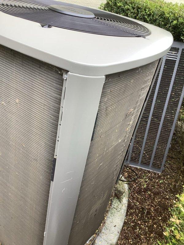 Completed comprehensive three-year Air Care Cooling maintenance on two outdoor condenser units. Performed standard ACM procedures including inspection of both units, noting accumulated dirt and debris on heat exchanger coil fins and exterior surfaces. Documented equipment condition with photos showing environmental exposure, weathering on concrete pad with moss/algae growth, and need for continued monitoring of coil cleanliness to maintain optimal system efficiency.