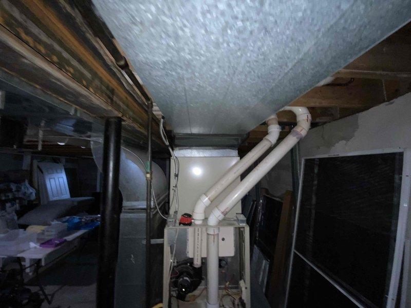 Provided estimate for complete furnace and air conditioning system replacement in basement location. Existing 1990s-era furnace still operational but air conditioning unit previously removed. Assessment included evaluation of existing ductwork, electrical connections, and basement mechanical room layout to determine equipment specifications and installation requirements for new HVAC system under BOGO promotion.