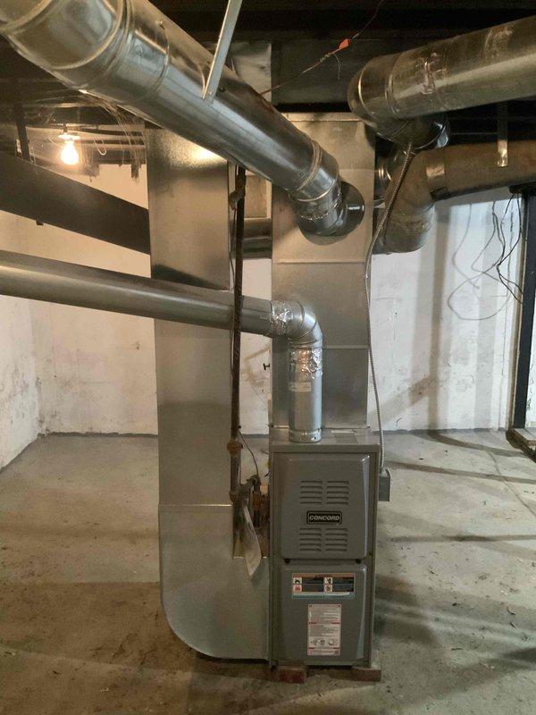 Completed comprehensive HVAC system evaluation for full air conditioning replacement estimate and chimney liner installation assessment. Inspected existing basement-mounted furnace and air handler configuration, documented current ductwork layout including galvanized metal supply ducts and connections, and photographed mechanical room conditions to provide accurate replacement specifications. Evaluated system accessibility, existing infrastructure compatibility, and provided detailed recommendations for complete AC unit replacement to address aging equipment with unknown service history.