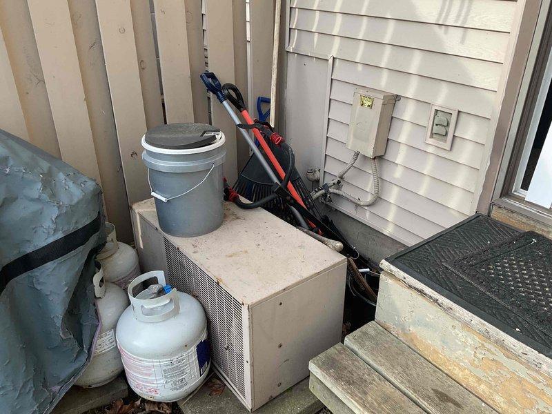 Conducted on-site assessment for complete air conditioning system replacement to address non-functional 30+ year-old unit currently located at rear of property. Evaluated basement furnace configuration with natural gas fuel source and existing ductwork infrastructure. Provided comprehensive replacement quote including options for relocating outdoor condensing unit to front of property per homeowner request, with equipment specifications and installation requirements for both standard replacement and relocation scenarios.