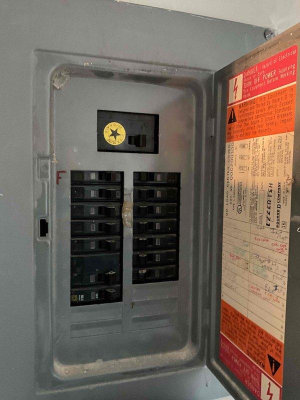 Conducted comprehensive equipment evaluation and replacement estimate for 30-year-old natural gas furnace and air conditioning system located in main utility room. Assessed existing Lennox outdoor condenser unit on concrete pad with exterior electrical disconnect, documented electrical panel configuration showing dual-row breaker arrangement with main disconnect, and evaluated current operational status of aging HVAC equipment to provide complete system replacement recommendations.