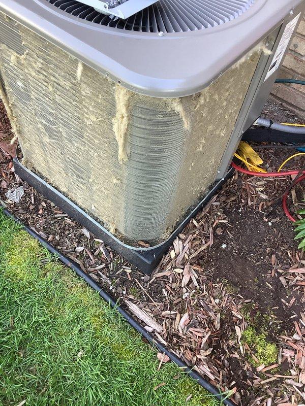 Completed annual comprehensive maintenance on residential outdoor condensing unit. Performed thorough inspection of heat exchanger coils, which displayed environmental buildup and oxidation on exterior surfaces. Evaluated condenser fins for damage and proper alignment, noting corrugated pattern remained intact. Assessed unit housing showing significant accumulation of dirt, debris, and organic material requiring attention. Verified proper positioning on concrete pad with protective base barrier. Documented unit condition through photographic records. Customer enrolled in residential maintenance agreement program and acknowledged no performance guarantees on existing equipment condition.