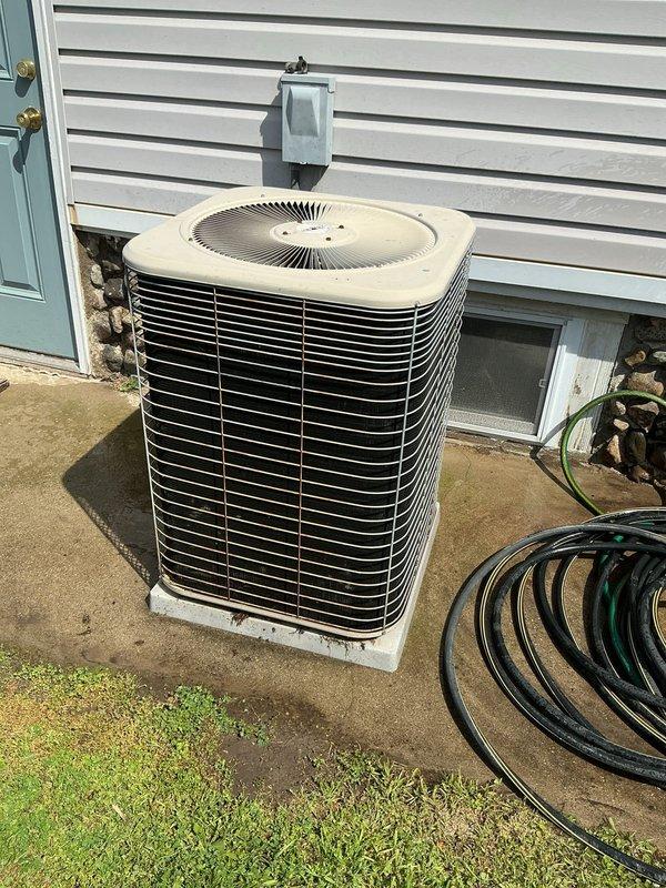 Completed comprehensive annual maintenance on residential central air conditioning system. Performed full AC tune-up including inspection of outdoor condenser unit, verified proper operation of fan motor and compressor, checked refrigerant levels, cleaned condenser coils, inspected electrical connections and disconnect box, and confirmed system functionality. Unit found in good operating condition with no issues identified during maintenance visit.