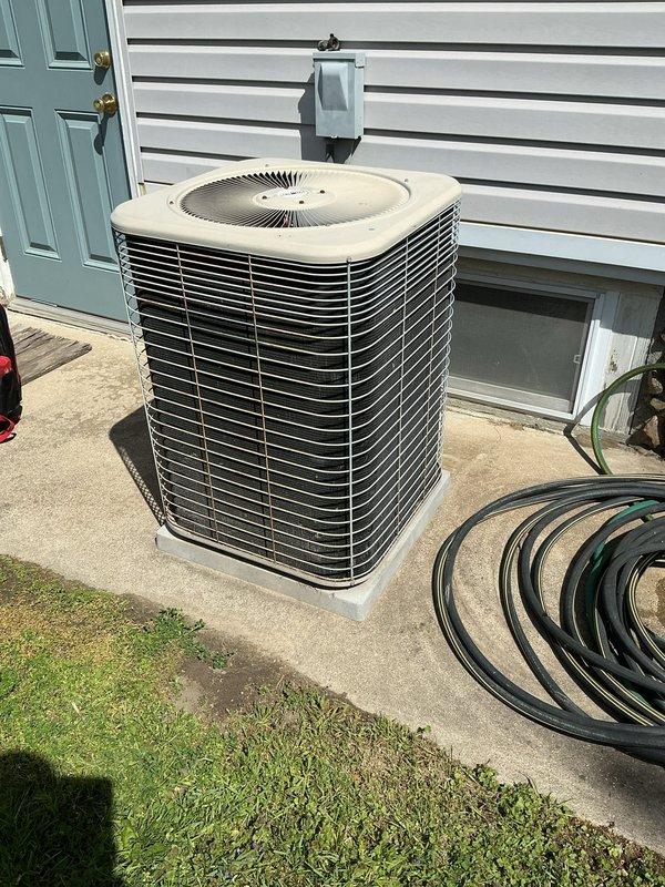 Completed comprehensive annual maintenance on residential central air conditioning system. Performed full AC tune-up including inspection of outdoor condenser unit, verified proper operation of fan motor and compressor, checked refrigerant levels, cleaned condenser coils, inspected electrical connections and disconnect box, and confirmed system functionality. Unit found in good operating condition with no issues identified during maintenance visit.