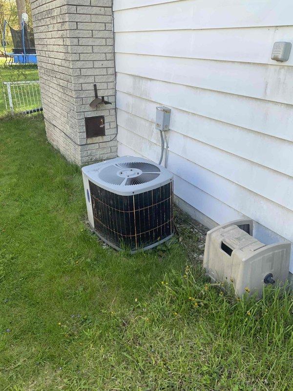 Conducted full system estimate for replacement of 30-year-old air conditioning system requiring immediate replacement. Assessed existing outdoor condensing unit with cylindrical configuration and evaluated indoor utility area housing water heater and associated mechanical components including ductwork and auxiliary equipment. Documented current system configuration, electrical connections, and installation conditions to provide comprehensive quote for new AC system replacement.