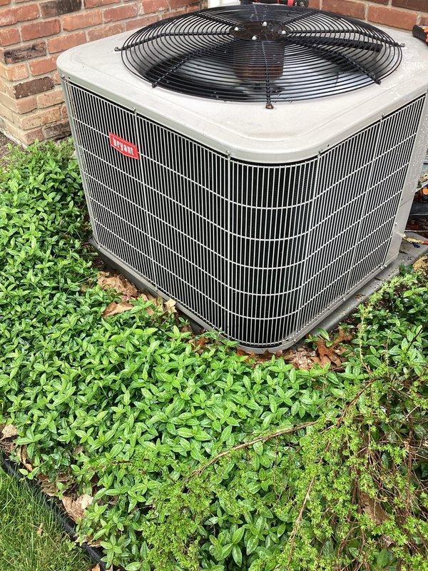 Completed annual preventive maintenance on residential split system air conditioning unit. Performed comprehensive inspection of outdoor condenser unit including coil condition assessment, fan motor operation verification, and electrical connection evaluation. Unit found operating within normal parameters with condenser coils clean and fan assembly functioning properly. Noted vegetation growth around unit base requiring customer attention to maintain adequate clearance for optimal airflow and future service access.
