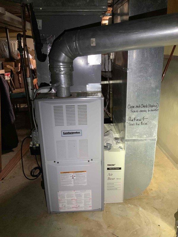 Provided comprehensive estimate for replacement of 20+ year old heating and cooling system located in basement, including furnace and air conditioning unit. Customer also requested pricing for whole home generator installation as part of complete home comfort solution. Current equipment operational at time of assessment; documented existing Comfortmaker furnace with associated ductwork and air handling components for replacement specifications.