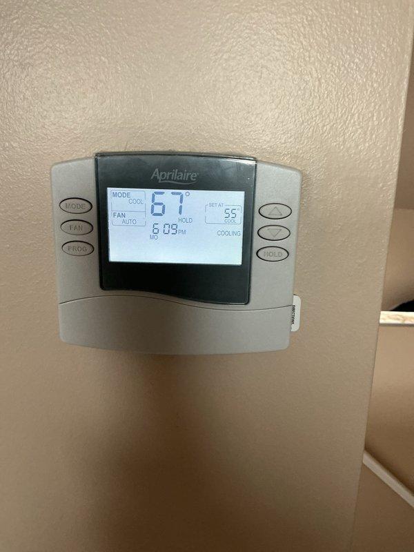 Completed comprehensive AC tune-up and maintenance on two central air conditioning units (4-year-old and 2-year-old systems). Performed thorough inspection of both systems, cleaned dirty air filters showing significant dust and debris accumulation, verified thermostat operation displaying proper cooling mode functionality at 67°F setpoint, and confirmed both units were operating within normal parameters. All components inspected and serviced to ensure optimal performance for the cooling season.