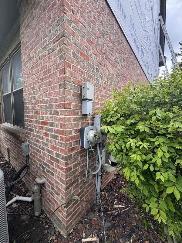 Provided estimate for replacement of non-functioning tankless water heater at residential property. Assessed existing outdoor tankless unit installation, documented current equipment location and utility connections including gas line and electrical service. Generated quote for complete tankless water heater replacement with new unit to be installed in same exterior location on existing mounting pad.