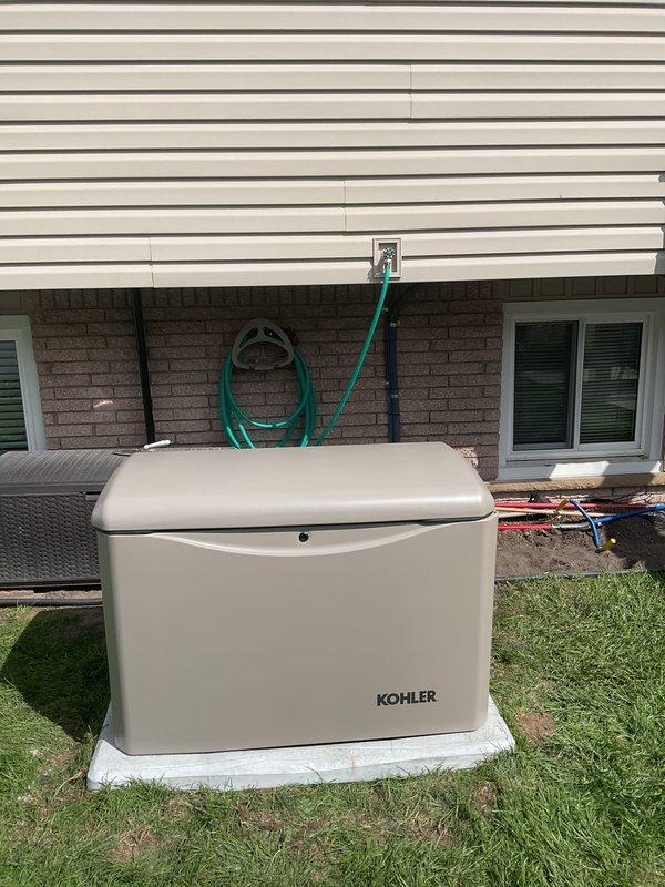 Completed full installation of KOHLER 20kW standby generator with 100-amp automatic transfer switch on concrete pad in residential backyard. Installation included electrical connections, gas pipe installation, pressure testing, and coordination of all required permits for mechanical, electrical, generator, gas piping, pressure test, and transfer switch systems. Unit positioned with proper clearances from structure, fully operational and ready for service.