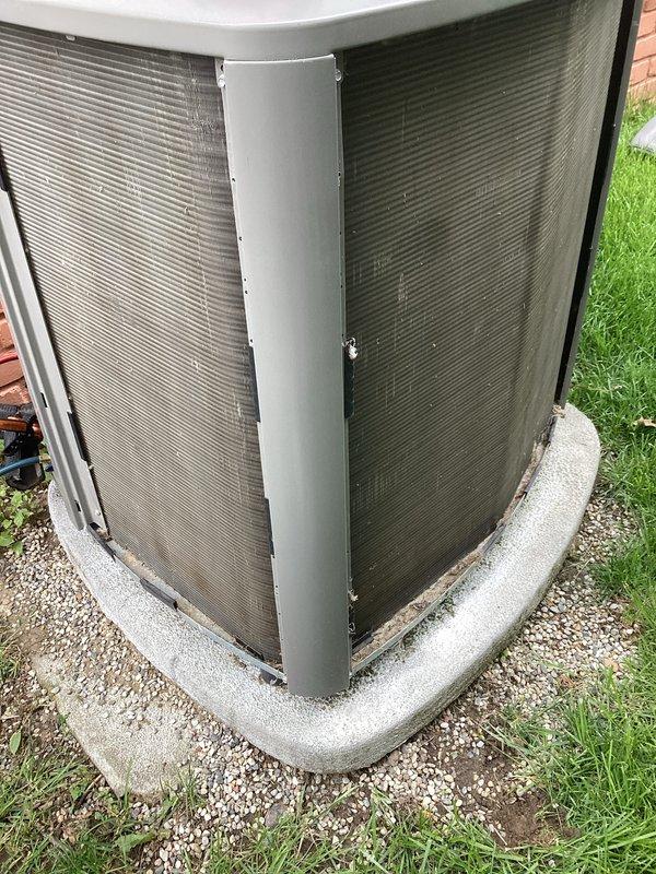 Performed scheduled maintenance on a five-year-old central air conditioning system. Upon arrival, conducted thorough inspection of outdoor condenser unit and found significant accumulation of dirt, dust, and debris on finned coil assembly, which was restricting airflow and reducing cooling efficiency. Cleaned condenser coils to restore proper airflow through the fins. Inspected refrigerant lines, electrical connections, and mounting hardware, all found to be in satisfactory condition. System tested and confirmed operational with proper cooling performance restored following maintenance procedures.