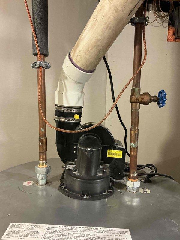 Provided comprehensive estimate for air conditioning system replacement in basement location. Current 27-year-old unit remains operational but has exceeded typical service lifespan. Documented existing HVAC installation including ductwork configuration, equipment positioning within confined mechanical space, and associated plumbing systems. Assessed accessibility considerations for replacement work given equipment location in utility area with existing water heater and circulation pump assembly.