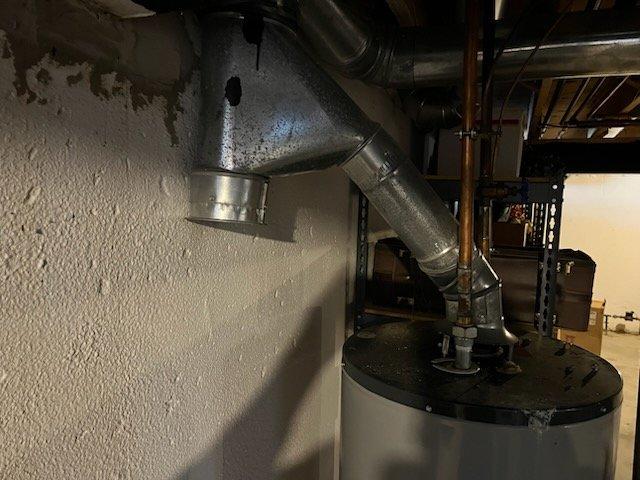 Completed annual preventive maintenance on residential cooling system. Performed comprehensive inspection of HVAC equipment, ductwork connections, and associated mechanical components in utility area. Documented equipment condition through photography showing water heater, furnace unit, metallic ductwork, copper supply lines, and plumbing connections all in operational status with no immediate service needs identified.