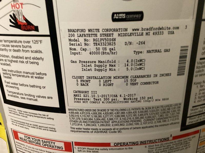 Responded to service call for leaking hot water tank in 31-year-old residential property. Upon inspection, identified active leak at base of Bradford White 50-gallon natural gas water heater (Model M-I-50US6N), which had reached end of serviceable life. Documented unit specifications, plumbing connections including copper supply lines with recirculation pump, gas shutoff valve, and visible water damage on concrete floor surrounding tank base, confirming immediate replacement required to prevent further water damage and restore hot water service.