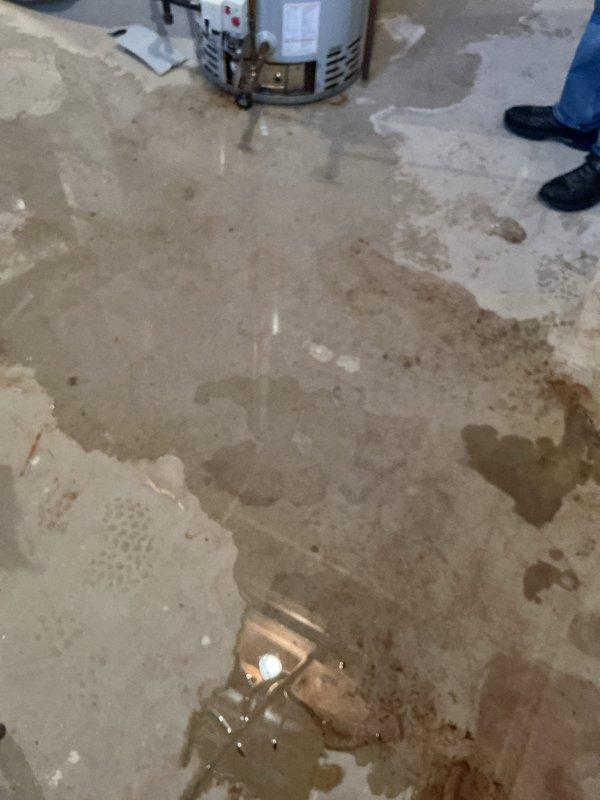 Responded to a call for a leaking hot water heater located in the basement. Upon arrival, found a 10-year-old residential water heater with extensive water damage on the concrete floor, including significant pooling and staining throughout the utility area. Performed diagnostic assessment to identify the source of the leak and documented the water damage conditions. The unit showed signs of age-related deterioration consistent with its 10-year service life. Completed inspection of the water heater, associated plumbing connections, and copper piping to determine the extent of the failure and provided recommendations for resolution.