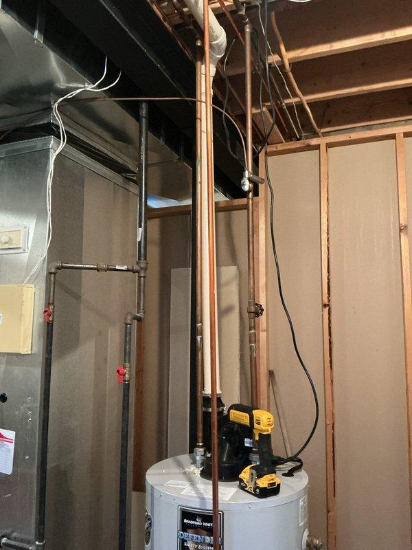 Responded to a call for a leaking hot water heater located in the basement. Upon arrival, found a 10-year-old residential water heater with extensive water damage on the concrete floor, including significant pooling and staining throughout the utility area. Performed diagnostic assessment to identify the source of the leak and documented the water damage conditions. The unit showed signs of age-related deterioration consistent with its 10-year service life. Completed inspection of the water heater, associated plumbing connections, and copper piping to determine the extent of the failure and provided recommendations for resolution.
